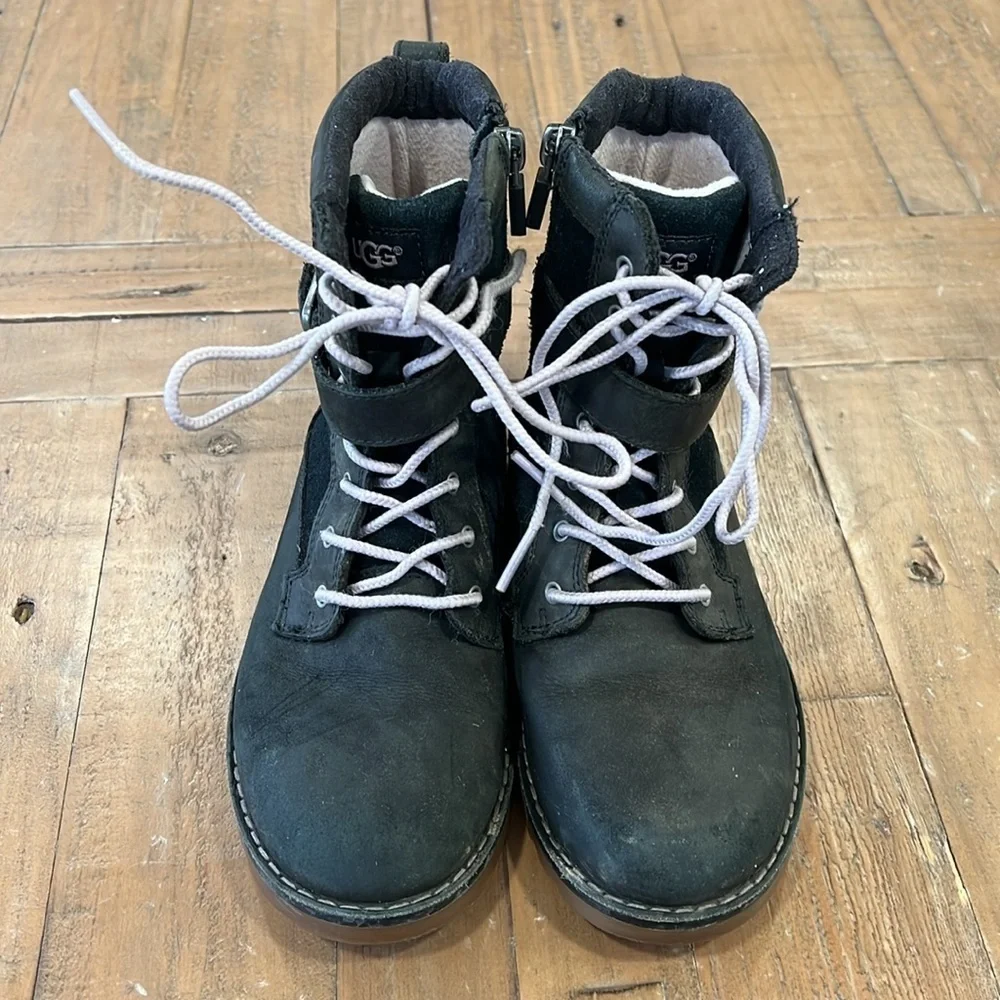 Ugg Koren black leather buckle strap lug sole boots